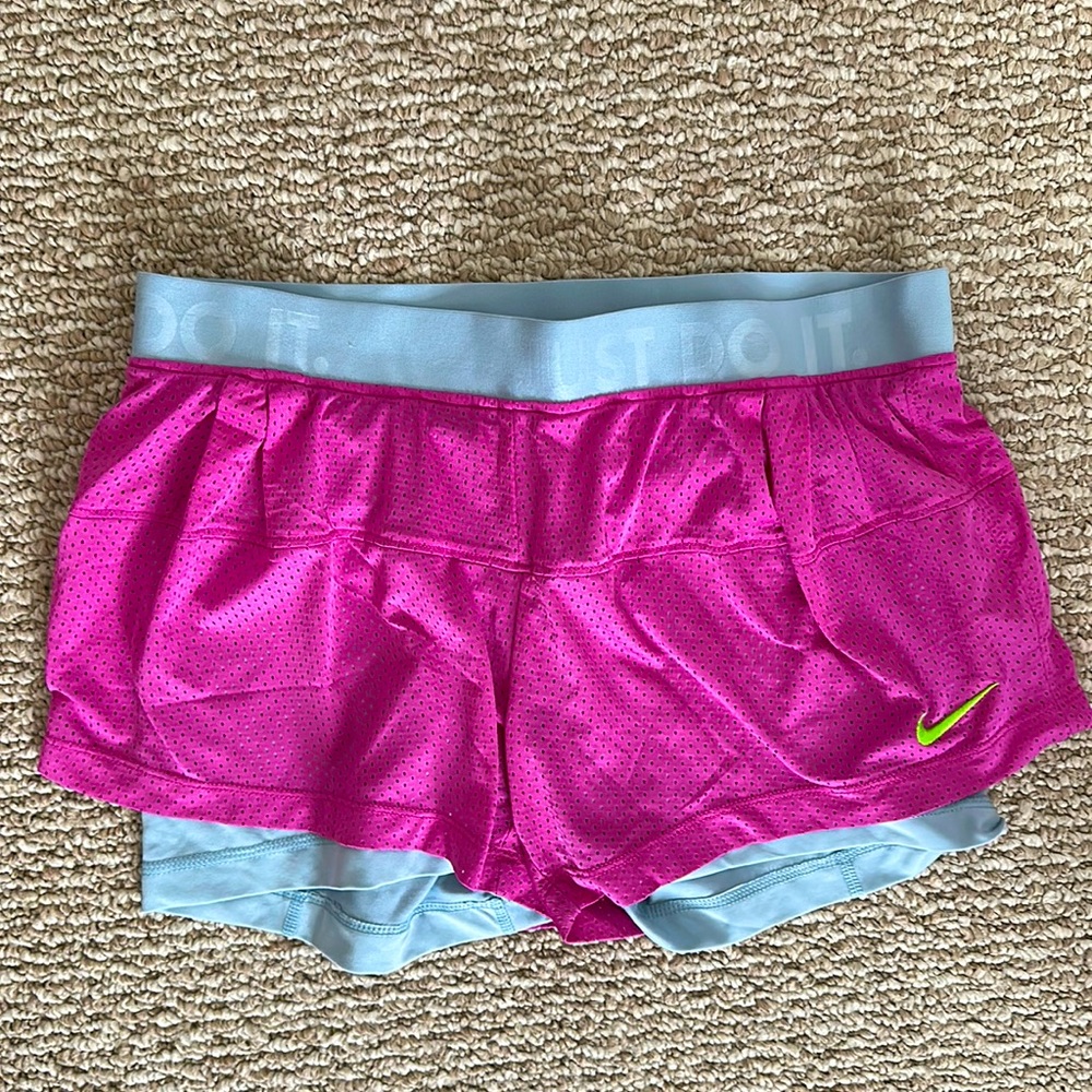 Nike mesh shorts layered over biker shorts